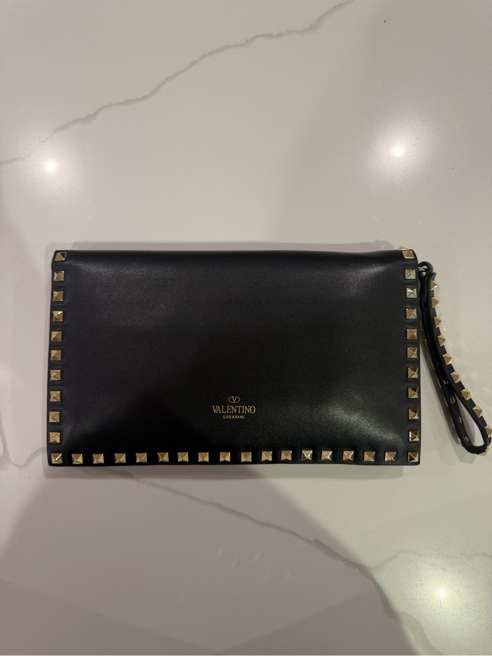 Valentino Garavani Black Leather Rockstud Wristlet Clutch with Gold Accents